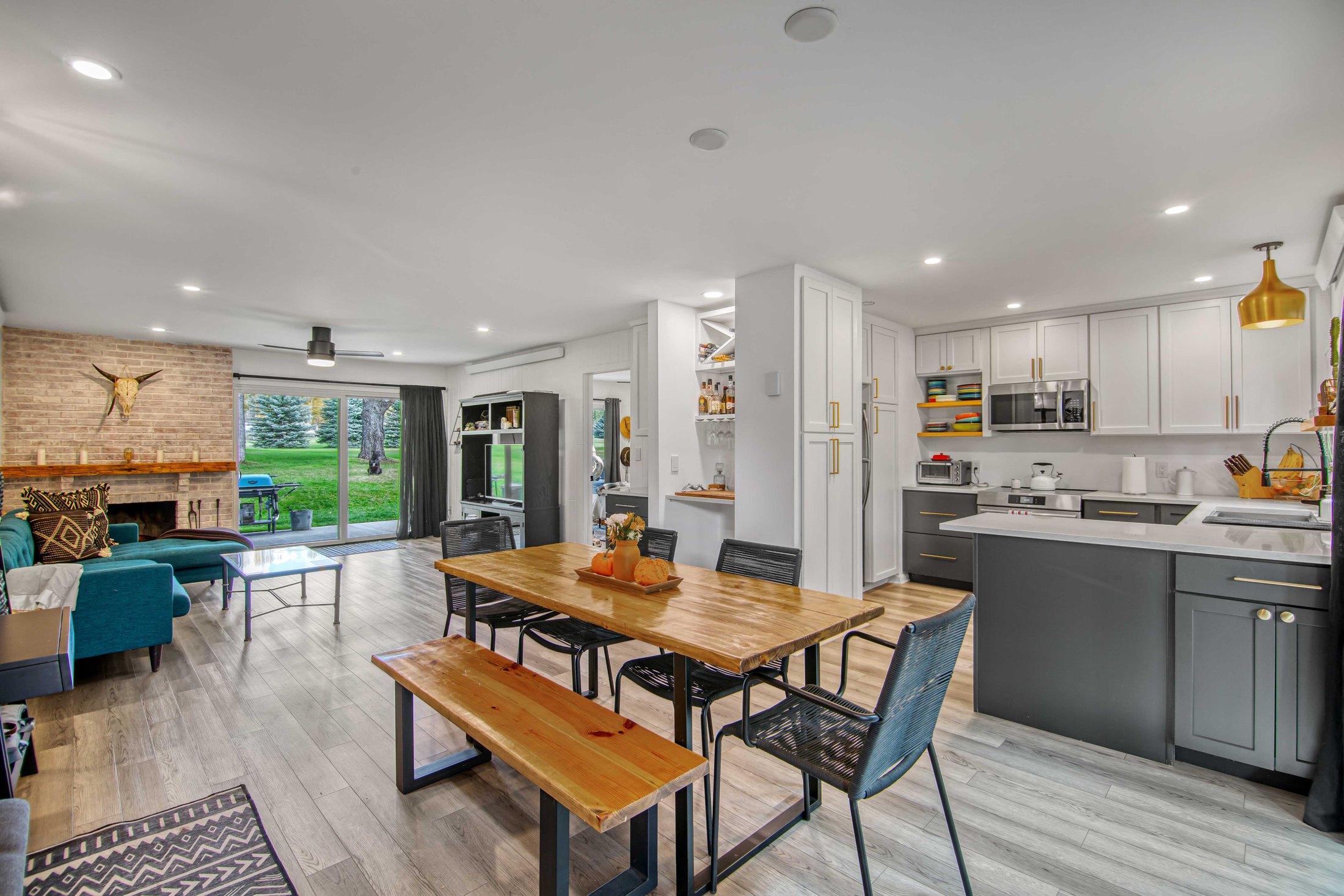 Connected living, dining, and kitchen spaces in a Carbondale vacation home