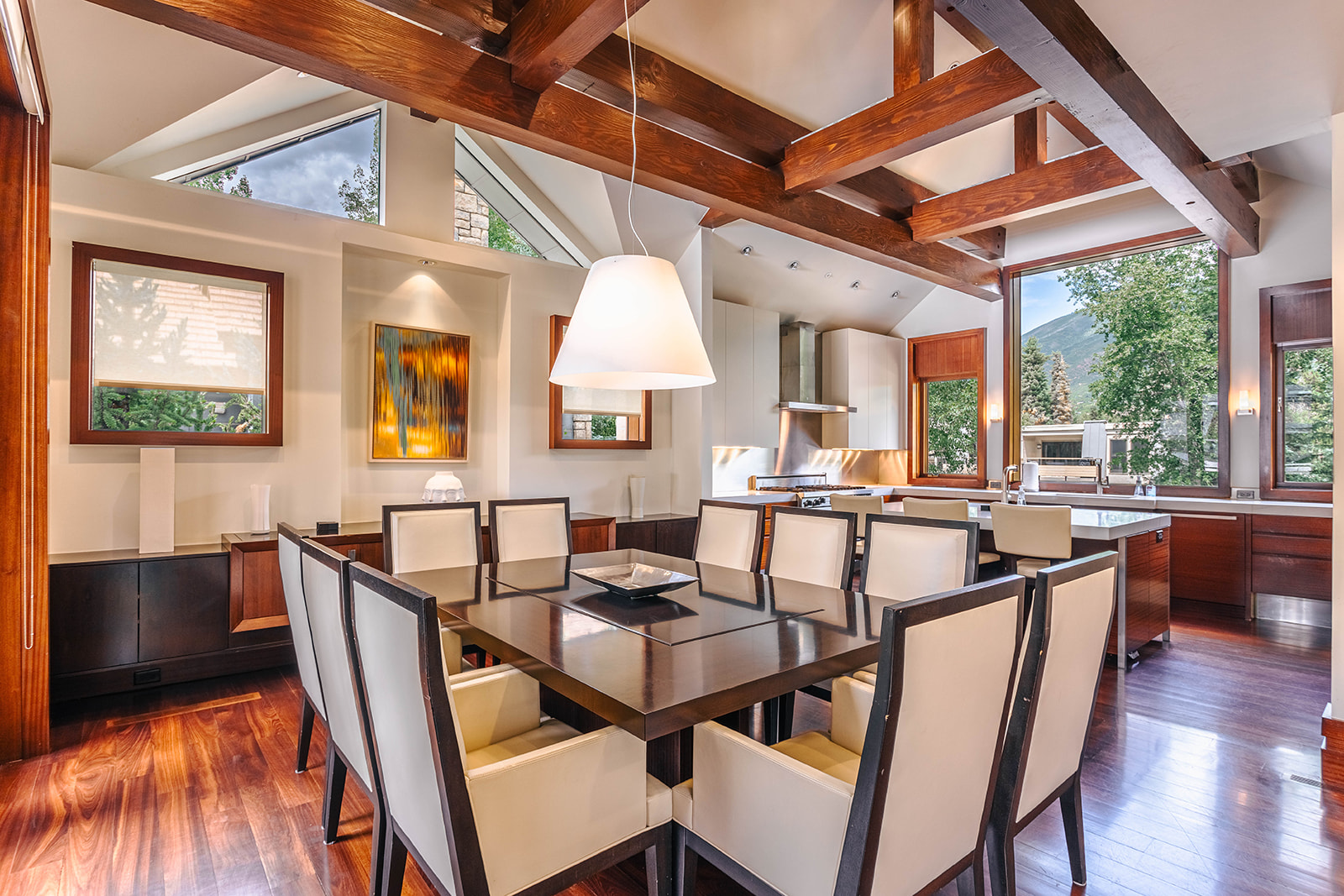 Hyman dining room opening into a bright kitchen