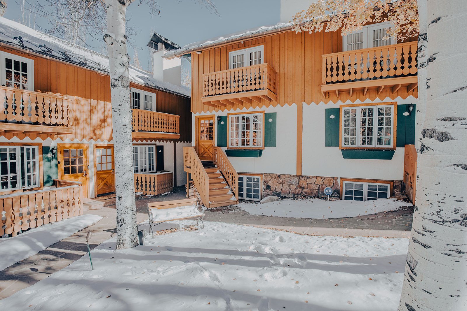 Aspen multifamily residences with timber balconies and shared courtyard access